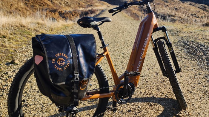 Auripo Orange bike on rail trail